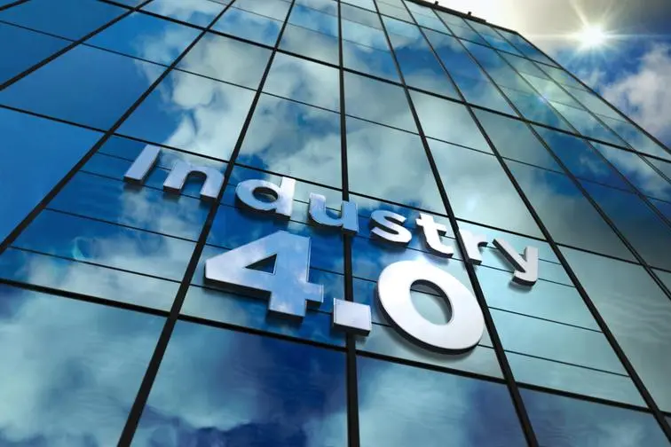 Industry 4.0 glass building. Mirrored sky and city on modern facade. Innovation, cyber technology, business, automate factory and robotic production concept concept in 3D rendering illustration. Image used for illustrative purpose. Image courtesy: Getty Images/ Arkadiusz Warguta , Getty Images