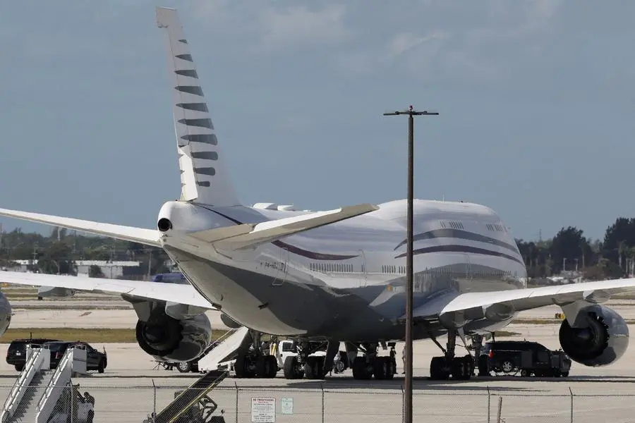 The motorcade of U.S. President Donald Trump is parked next to a 12-year old Qatari-owned Boeing 747-8 that Trump was touring in West Palm Beach, Florida, U.S., February 15, 2025. REUTERS/Kevin Lamarque , Reuters