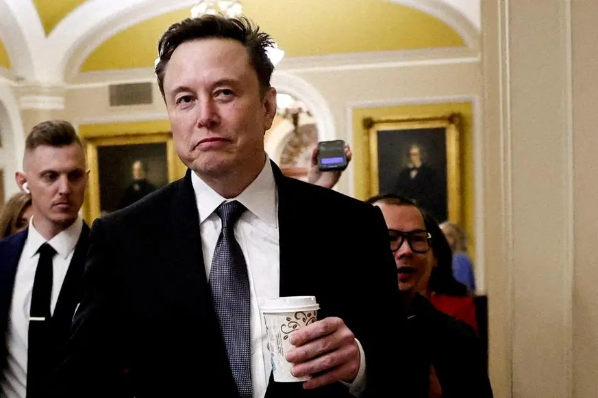 FILE PHOTO: Elon Musk walks on Capitol Hill on the day of a meeting with Senate Republican Leader-elect John Thune (R-SD), in Washington, U.S. December 5, 2024. REUTERS/Benoit Tessie. , Reuters