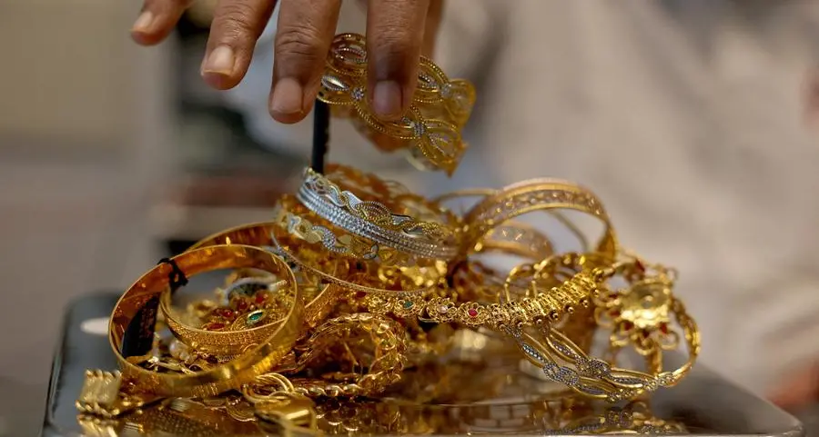 Gold edges higher from over 1-1/2-month low but higher yields cap gains