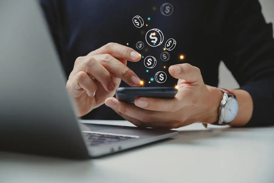 Hand of businessman using smart phone with coin icon, Online transaction, fintech business, Internet investment e-Commerce concept. Image used for illustrative purpose, Getty Images , Getty Images