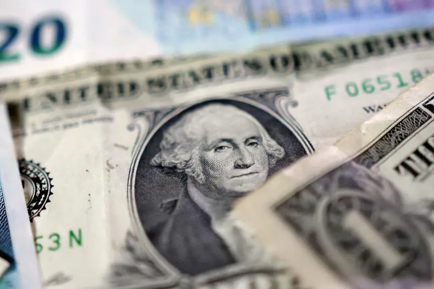 Dollar trades sideways before tax vote, Aussie holds gain before RBA