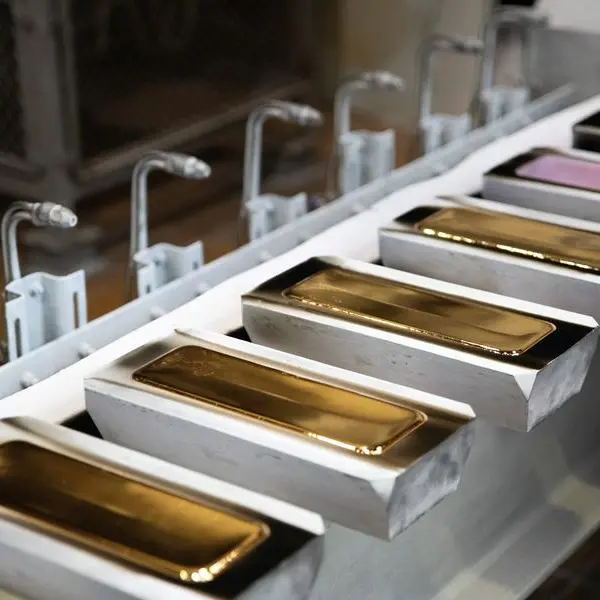 Gold on track for third weekly loss on firm dollar, hawkish Fed signals