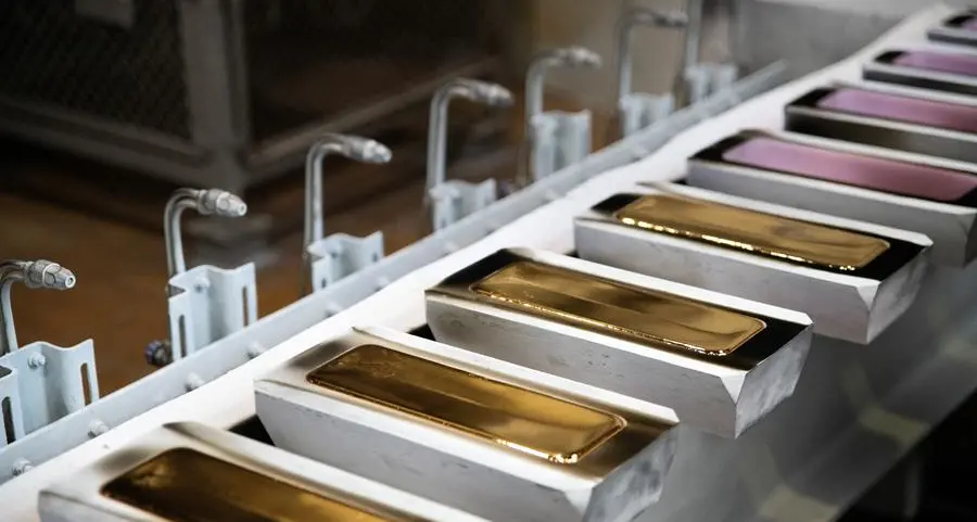 Gold on track for third weekly loss on firm dollar, hawkish Fed signals