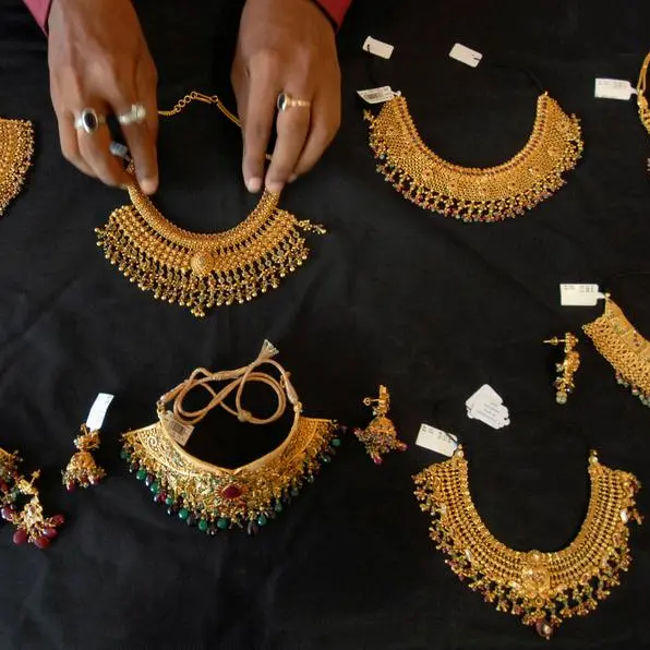 Gold rises on dip-buying but heads for fourth weekly loss