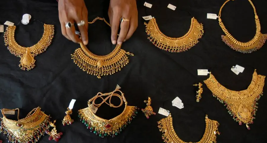 Gold rises on dip-buying but heads for fourth weekly loss