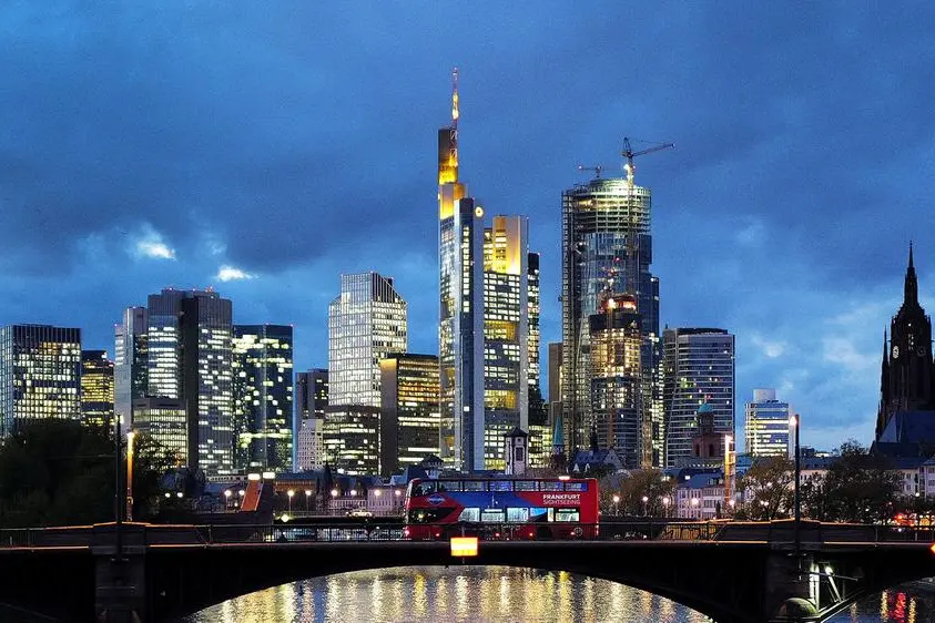 FILE PHOTO: A double decker bus passes the skyline with its dominating banking district in Frankfurt, Germany, November 8, 2023. REUTERS/Kai Pfaffenbach. , Reuters
