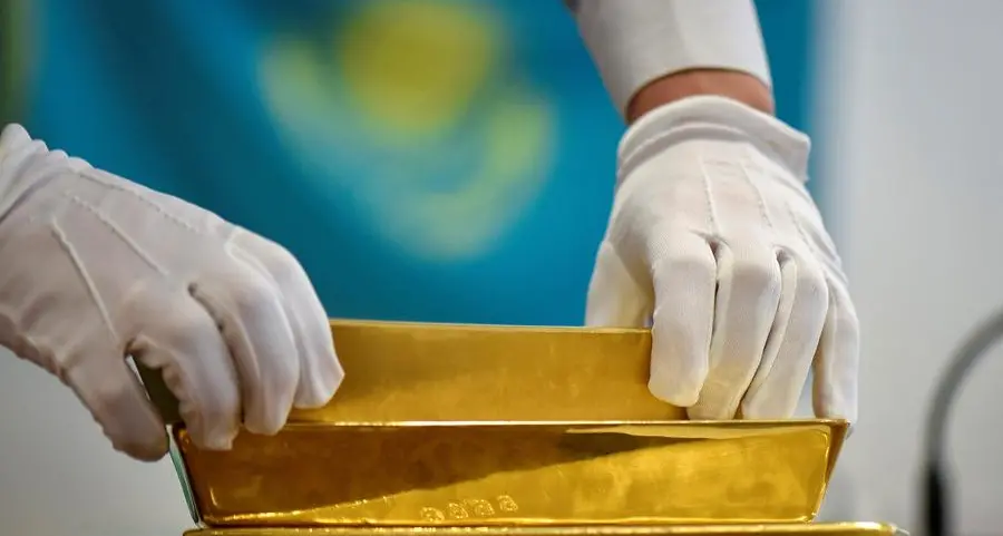 Gold prices slide over 2% as dollar firms, investors book profits