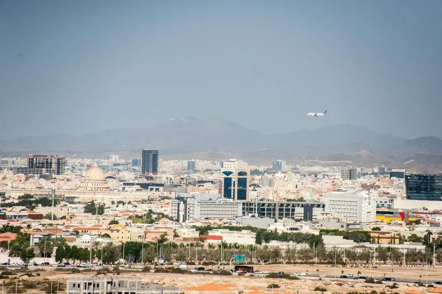 Panoramic view of the skyline of Jeddah with an airplane flying low over the horizon approaching Jeddah airport and the lower Hijaz mountains in the distance in Mecca province, Saudi Arabia. Image used for illustrative purpose only. Getty Images , Getty Images
