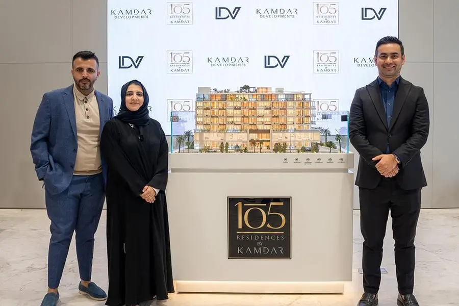 Scale model of 105 Residences flanked by (left) Mahomed Kamdar, Director and Tazmeen Kamdar, Director, Kamdar Developments and (right) Santosh Shrestha, CEO of Luxedesign.