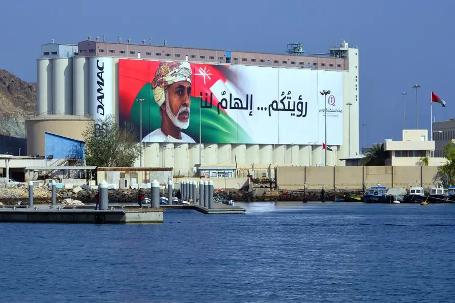Muttrah, Muscat, Oman: cereals pier at Port Sultan Qaboos - grain handling facilities - cereals silos with large canvas with Sultan Qaboos and the Omani flag, with the motto \"your vision... the inspiration\". DAMAC Properties logo on the left side. Image used for illustrative purpose Getty Images , Getty Images