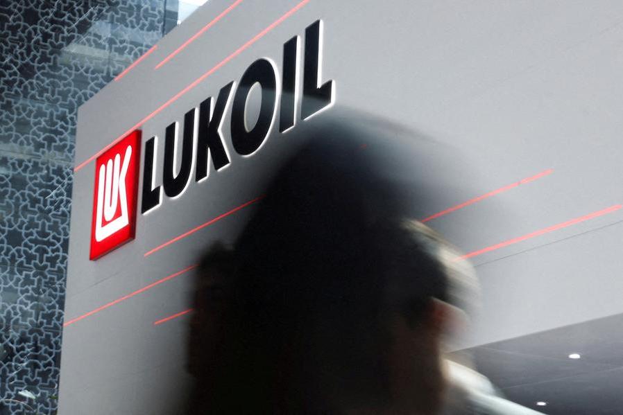 Russia's Lukoil, under sanctions, agrees to sell international assets to US Carlyle Group