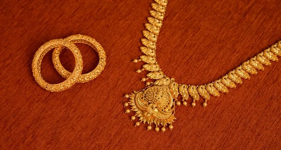 Gold climbs on soft employment data, lower oil ahead of US payrolls report