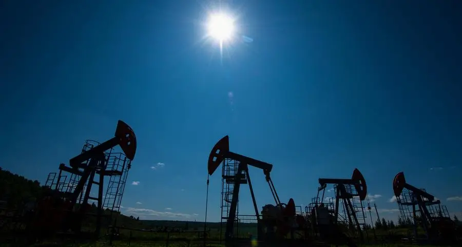 Oil inches down as investors focus on Hormuz flows after peace talks