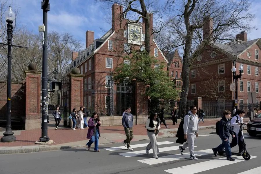 Students walk outside of Harvard Yard at Harvard University in Cambridge, Massachusetts, U.S., April 15, 2025. REUTERS/Faith Ninivaggi. , Reuters
