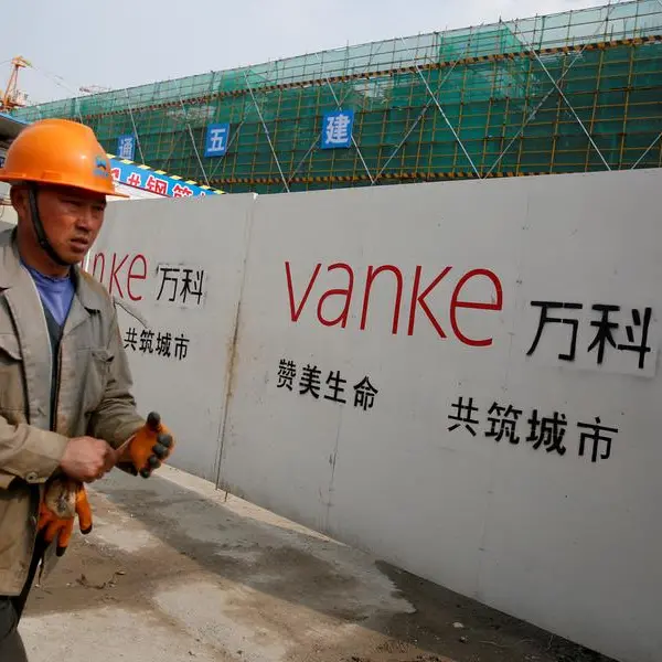 China Vanke yuan bonds plunge to record low, triggering trading halt