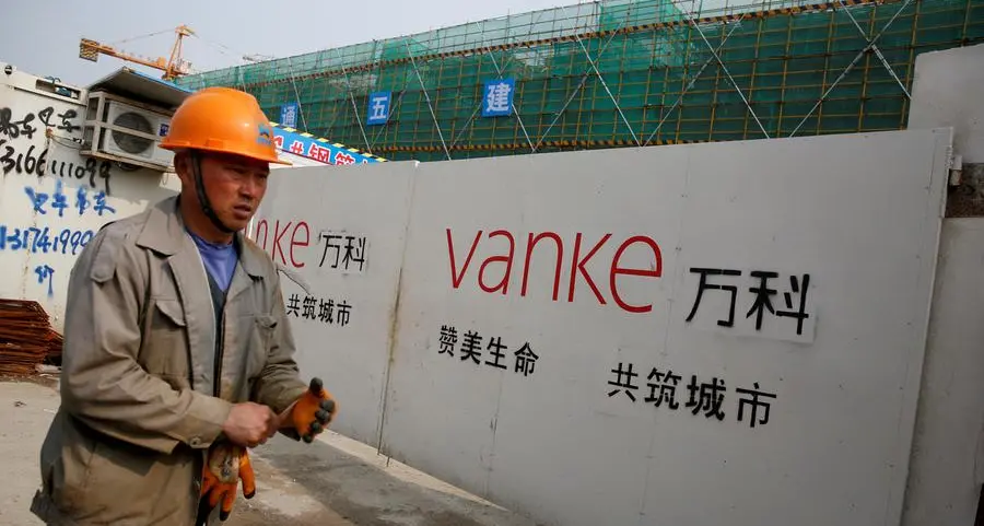 China Vanke yuan bonds plunge to record low, triggering trading halt