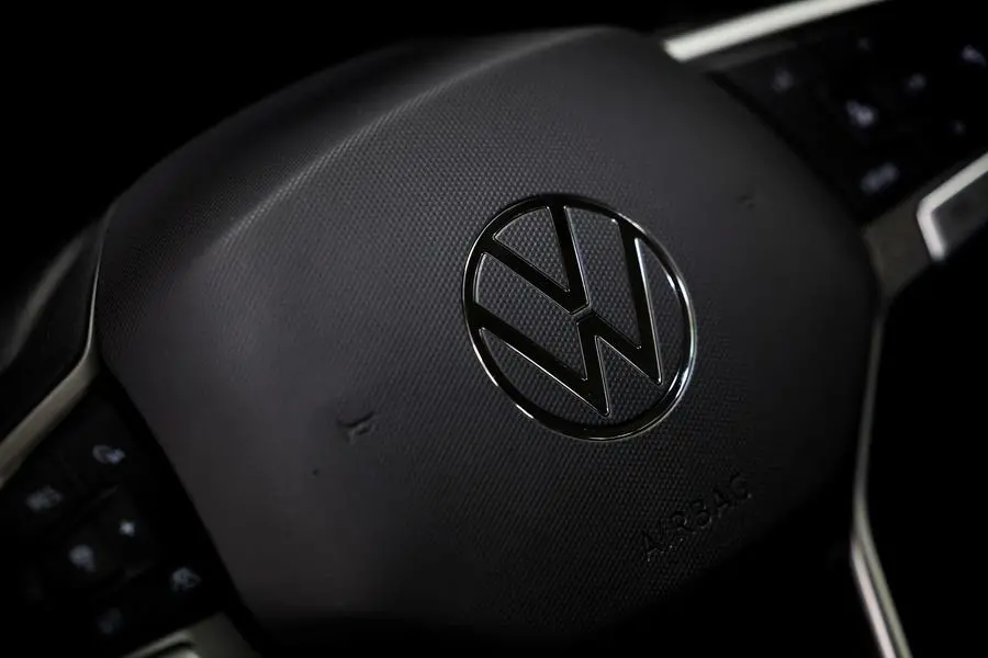 A logo of Volkswagen is seen inside a car dealer in Nijmegen, Netherlands February 26, 2025. REUTERS/Piroschka van de Wouw. , Reuters