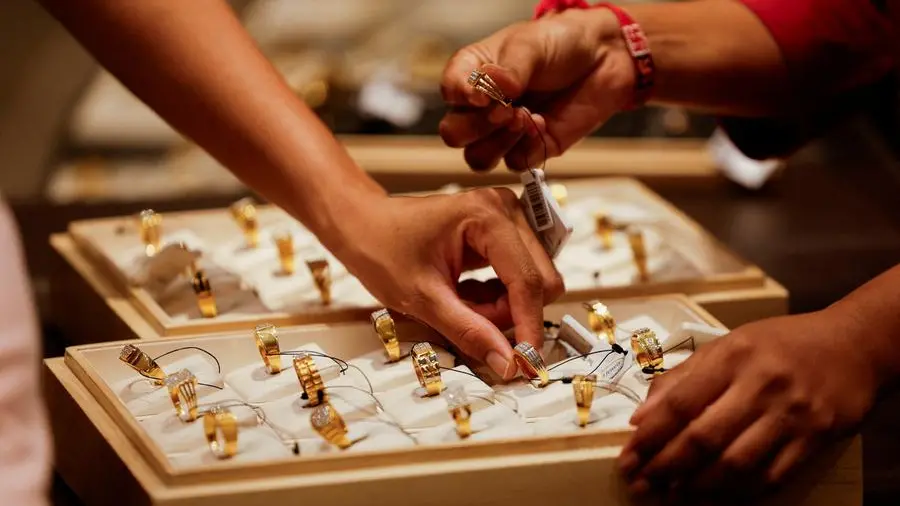 Gold hits seven-week high on safe-haven demand; silver notches peak