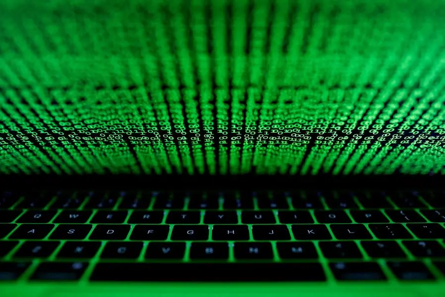 FILE PHOTO: A computer keyboard lit by a displayed cyber code is seen in this illustration picture taken on March 1, 2017. REUTERS/Kacper Pempel/Illustration/File Photo , Reuters/REUTERS