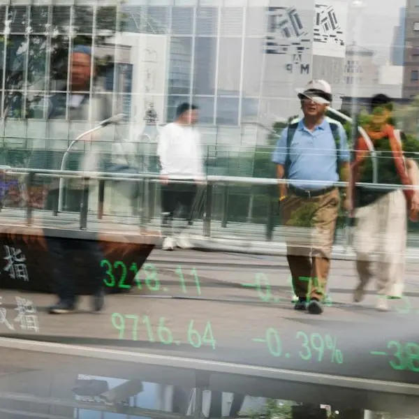 Asian stocks rise as traders weigh US debt, trade deals