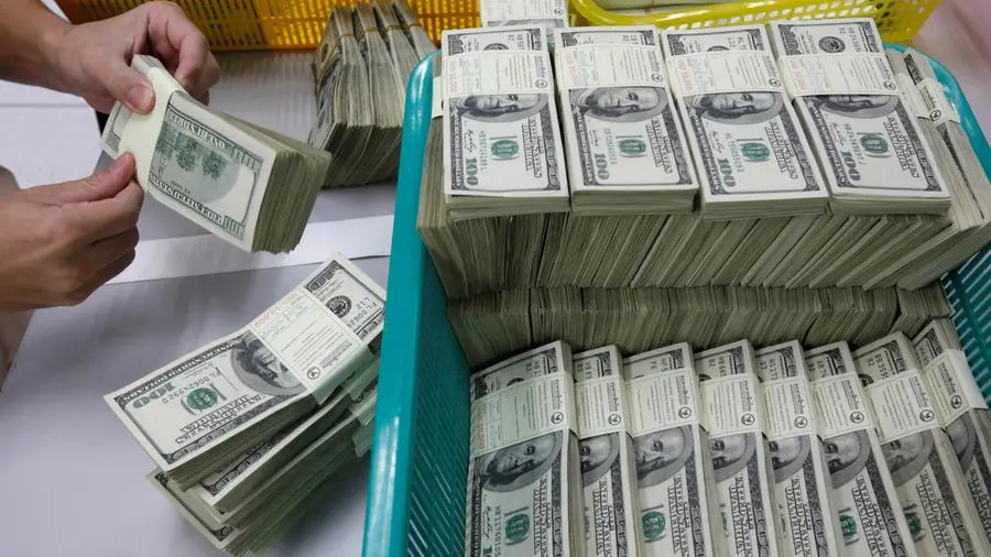 Dollar wobbles as Fed soothes market nerves with rate cut projection