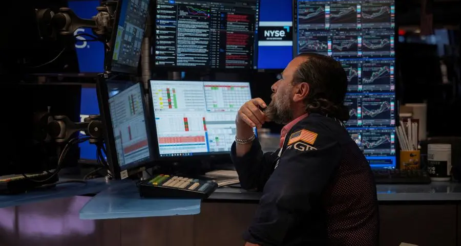 World shares hover near record highs as US-Canada trade talks revived