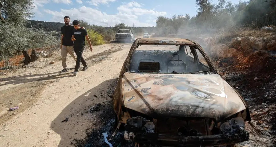 West Bank farmers gather precious olives as harvest season brings new settler attacks