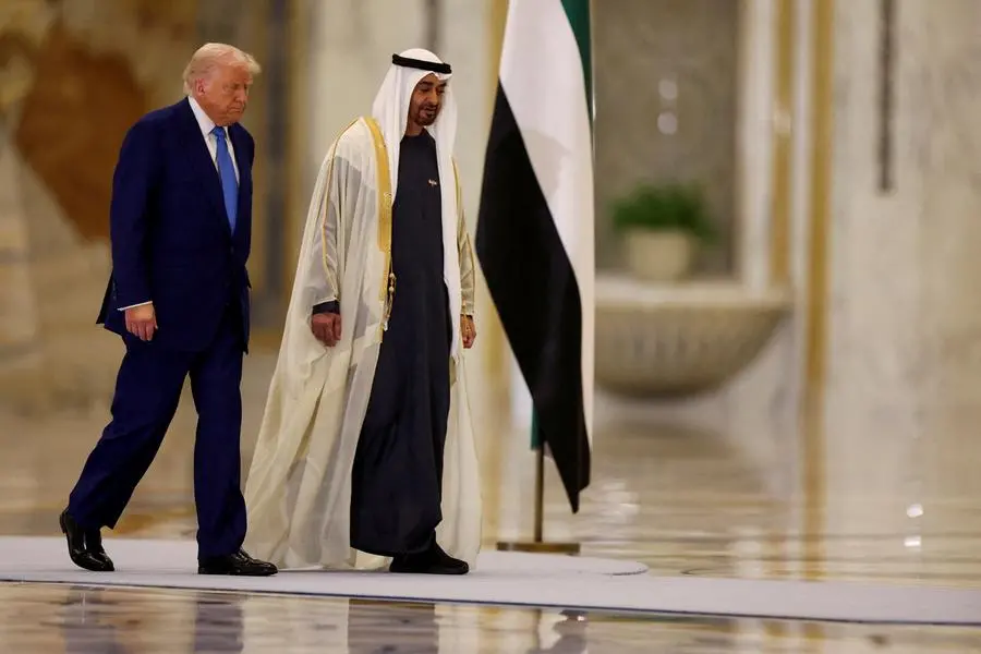 U.S. President Donald Trump walks with United Arab Emirates President Sheikh Mohamed bin Zayed Al Nahyan during their meeting, at Qasr Al Watan, in Abu Dhabi, United Arab Emirates, May 15, 2025. REUTERS/Amr Alfiky , Reuters/REUTERS