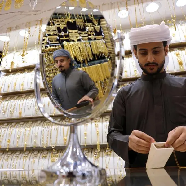 Gold races to $5,100 record peak on safe-haven demand