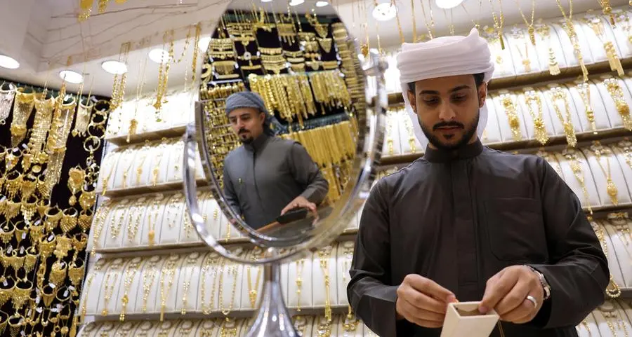 Gold races to $5,100 record peak on safe-haven demand