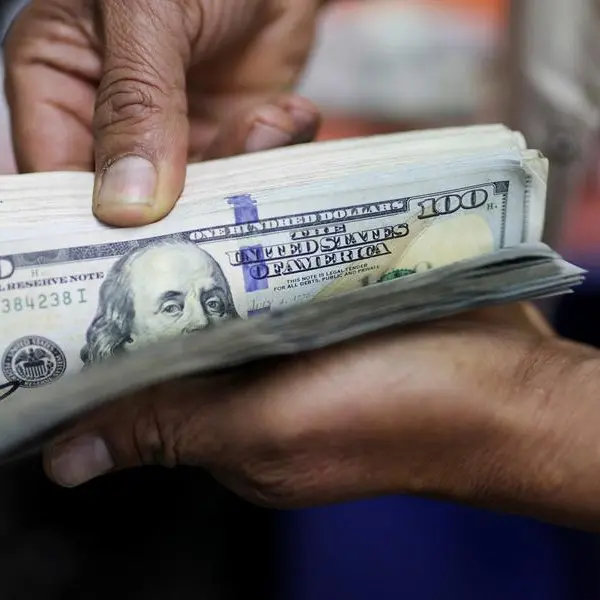 Dollar clings on to gains from US-China trade pact