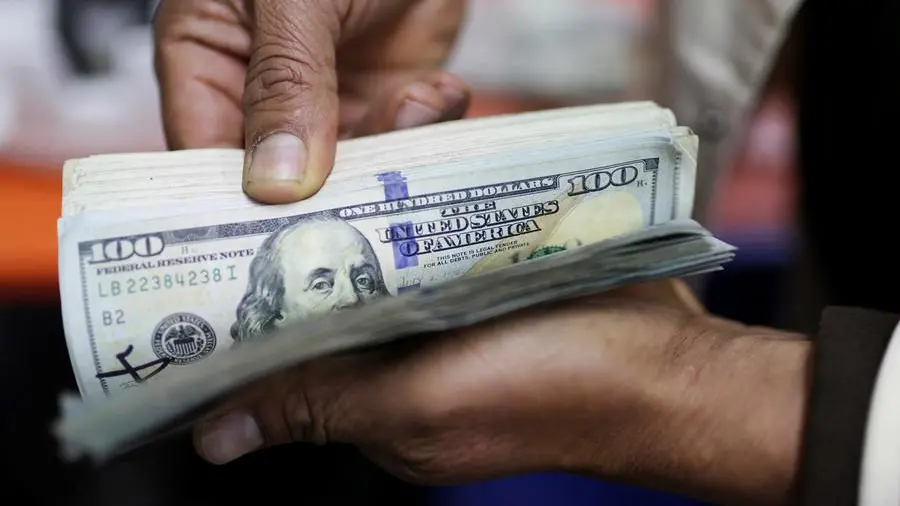 Dollar clings on to gains from US-China trade pact