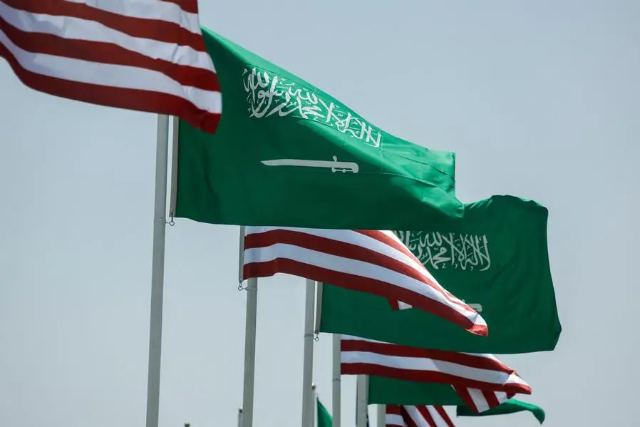 U.S. and Saudi flags flutter along a highway of Riyadh, as pictured through the glass of a car, ahead of the arrival of U.S. President Donald Trump to Riyadh, Saudi Arabia May 12, 2025. REUTERS/Hamad I Mohammed REFILE-QUALITY REPEAT\\u2028 , Reuters/REUTERS