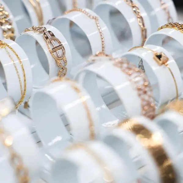 Gold rises as soft dollar, Trump's tariff threats spur safe-haven demand