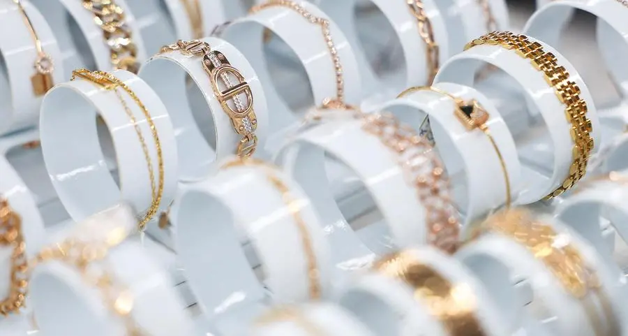 Gold rises as soft dollar, Trump's tariff threats spur safe-haven demand