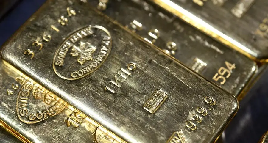 Gold slips to one-week low as safe-haven buying stalls, dollar strengthens