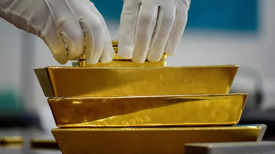 Silver tops $75 as gold and platinum surge to records