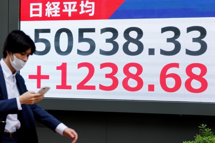 Stocks rise, dollar wilts as investors strap in for Fed rate cut