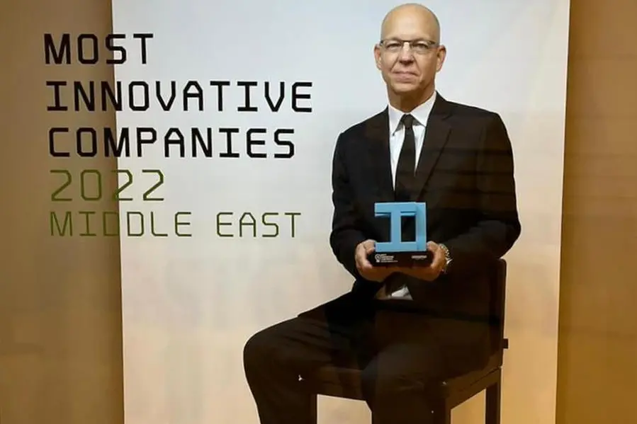 Dr. Ray O. Johnson, CEO, Technology Innovation Institute, with the award