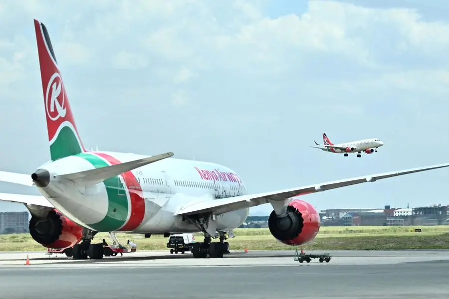 (FILES) A passenger plane operated by Kenya Airways approaches for landing on March 24, 2020 at the Jomo Kenytta Airport. Kenya Airways (KQ) announced the suspension of flights to Kinshasa starting April 30, 2024, citing the detention of two employees by a military intelligence unit in the Democratic Republic of the Congo as the reason for the move. (Photo by TONY KARUMBA / AFP) , Agence France-Presse (AFP)/AFP