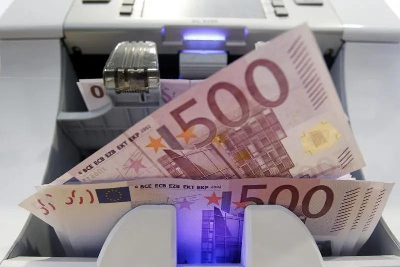 Image used for illustrative purpose. A money counter counts 500 euro banknotes in a Bank in Bern August 15. Reuters, Pascal Lauener , Reuters Images