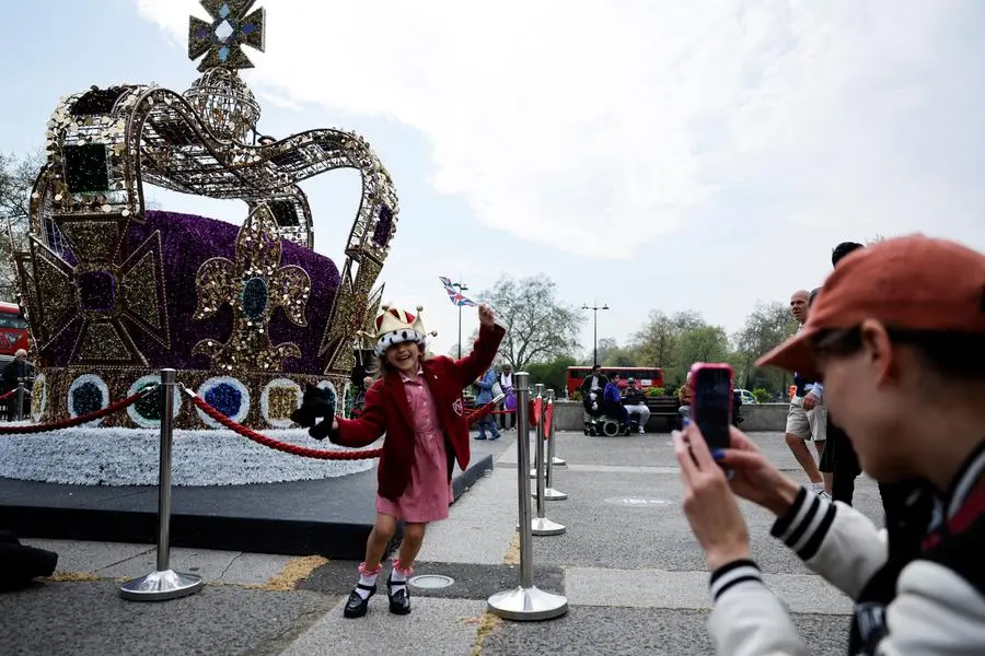 Summer, 5, poses in front of an imitation of St Edward\\'s crown ahead of the Coronation of King Charles and Camilla, Queen Consort, in London, Britain May 4, 2023. REUTERS/Clodagh Kilcoyne , REUTERS
