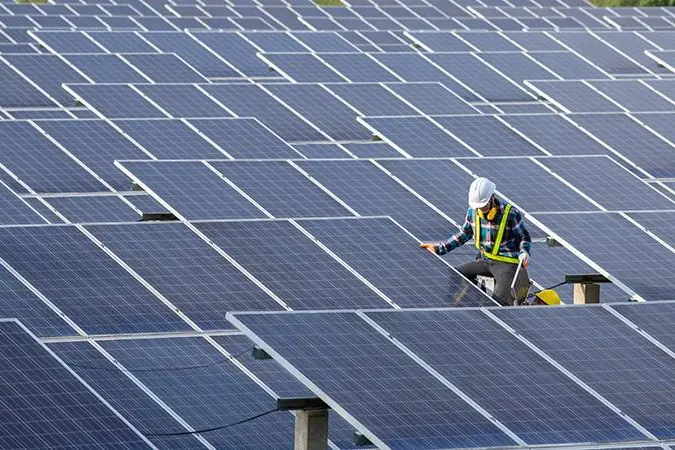 Engineer working on checking equipment in solar power plant. Getty Images Image used for illustrative purpose. , Getty Images