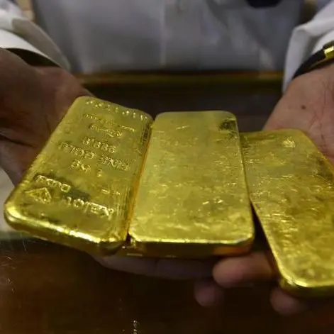 Gold climbs higher on dollar dip, Fed pause bets