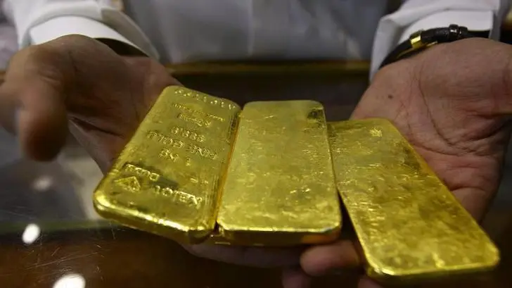 Gold climbs higher on dollar dip, Fed pause bets