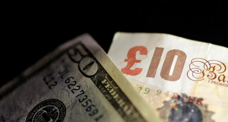 Sterling ticks lower versus dollar in quiet session