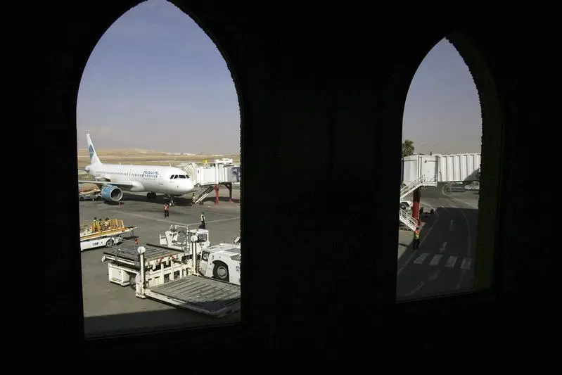 Workers unload cargo from an airplane at Queen Alia Airport, 35 km (22 miles) south of Amman, February 9, 2010. Muhammad Hamed, Reuters Image for illustrative purposes. , Reuters Images