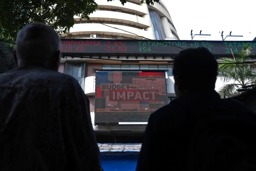Men watch a screen displaying the Sensex results on the facade of the Bombay Stock Exchange (BSE) building in Mumbai, February 1, 2023. REUTERS/Niharika Kulkarni , Reuters