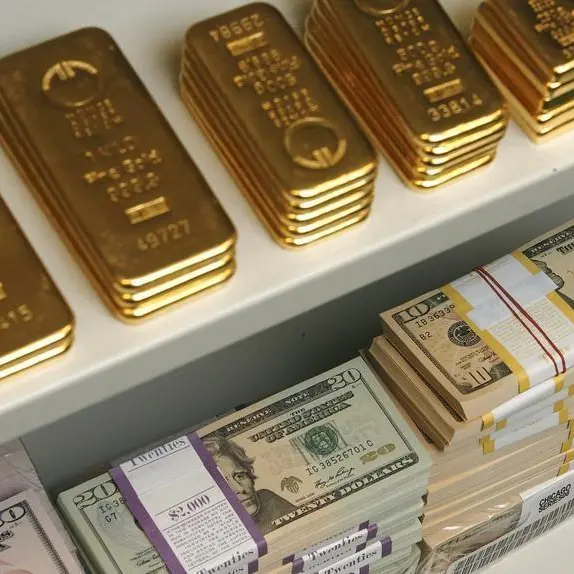 Gold slips as dollar firms, cenbank meetings in focus